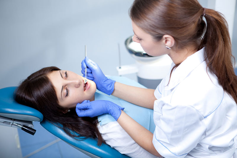 Dentist checking teeth