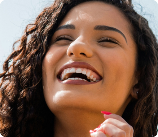 A person smiling confidently with a bright smile.