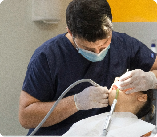 A doctor performing general dentistry procedures on a patient in a dental clinic.